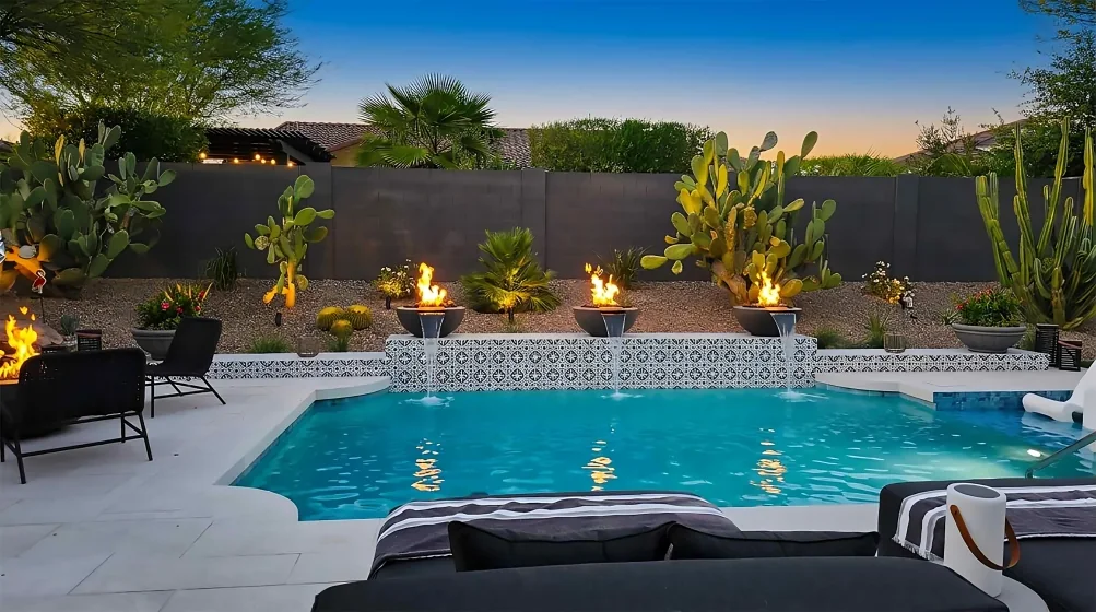 Desert-style Arizona backyard with custom pool, spa, landscaping, and mountain views